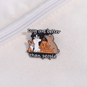 Enamel dog badge featuring cartoon puppies with 'Dog are better than people' text