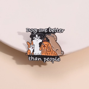 Detail of enamel dog badge featuring cartoon breeds and Dog are better than people text