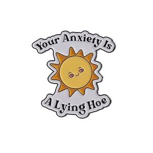 Enamel sun pin badge featuring 'Your Anxiety Is A Lying Hoe' motivational text