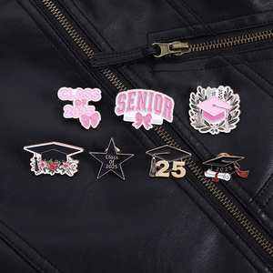 Set of seven pink and gold enamel graduation pins featuring Class of 2025 motifs