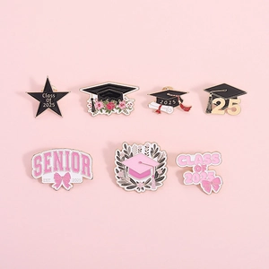 Set of seven pink enamel graduation pins with Class of 2025 and floral mortarboard motifs