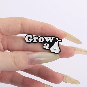 Creative black and white pear shaped enamel pin with Grow a text on hand
