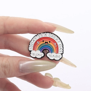 Detail of rainbow enamel pin with satirical quote Today is a great day to leave me alone