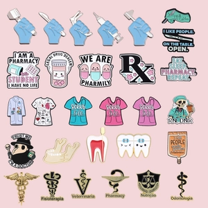 Set of 28 medical-themed enamel pins featuring cartoon doctor and nurse gear on pink background