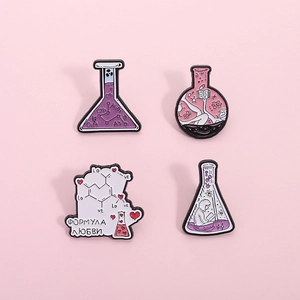 Set of four creative chemistry lab enamel pins featuring flask designs and love formulas