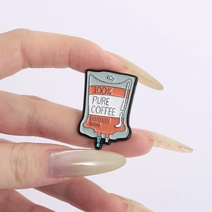 Macro shot of creative 100% pure coffee infusion bag enamel pin with zinc alloy detail