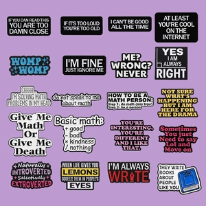 Macro view of 20 creative enamel brooch pins featuring various English slogans and typography