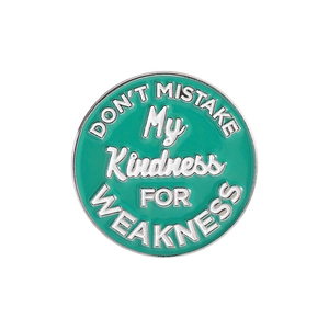 Minimalist round enamel pin with Don't Mistake My Kindness for Weakness quote