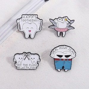 Set of four cute cartoon tooth enamel pins with dentist and dental floss themes