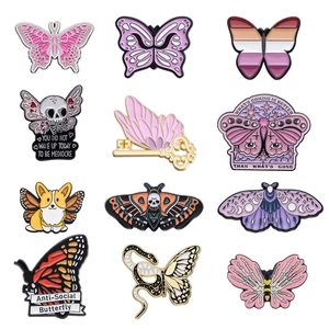 Creative enamel pin set featuring 12 unique butterfly and skull designs on white background