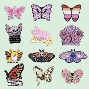 Set of 12 creative butterfly enamel pins with skull and inspirational text designs