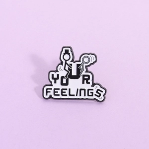 Cartoon stick figure enamel pin with Your Feelings text on light purple background