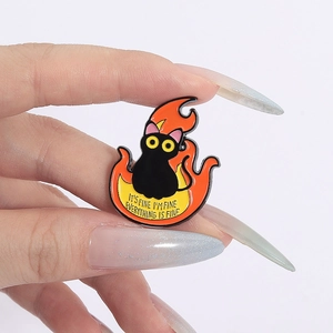 Detail of creative black cat enamel pin with fire and funny it is fine quote text