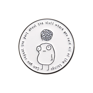 Cartoon monster enamel pin with black lines and humorous quote on white background