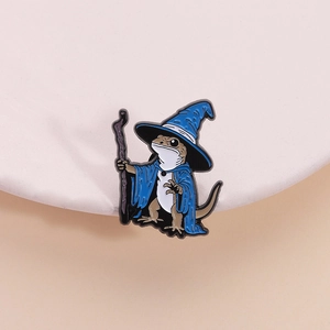 Lizard wizard enamel pin with blue magic hat and cloak on a minimal white stand