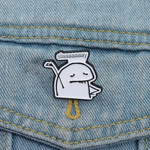 Minimalist stick figure enamel pin with slaaaaaaay text on blue denim jacket