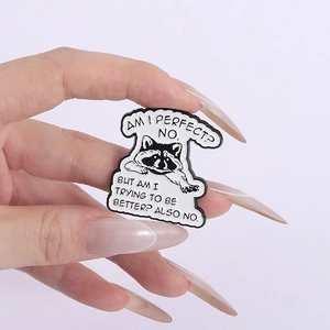 Detail view of raccoon enamel pin with humorous English text on a metallic badge