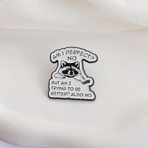 Funny raccoon enamel pin with sarcastic quote on white ceramic tray for accessories