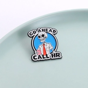 Funny skeleton enamel pin in office shirt with Go Ahead Call HR text in blue circle