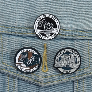 Vintage high-top sneaker enamel pins set on denim jacket with street style slogans
