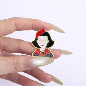 Detail of enamel pin featuring a woman in a red beret with a Russian flag scarf