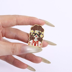 Cartoon girl enamel pin with wavy hair and daisy glasses on a striped shirt
