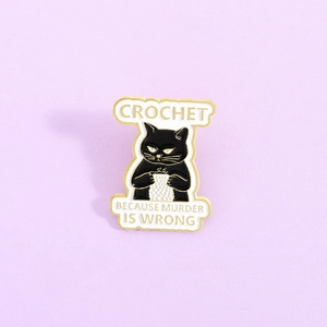 Funny black cat enamel pin with Crochet Because Murder Is Wrong quote on purple background