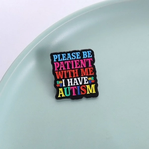 Colorful Please Be Patient With Me autism awareness enamel brooch pin on blue plate