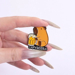 Detail of Capybeera enamel pin showing a cute capybara holding a beer with metal finish