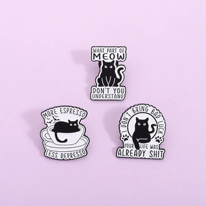 Three-piece set of creative black cat enamel pins with humorous quotes on a purple background