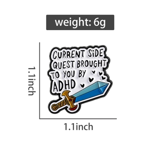 Detail showing the 1.1-inch sword enamel pin size and weight for ADHD side quest badge
