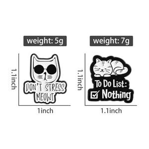 Detailed view of cat enamel pins with sizes and weights for white and striped designs