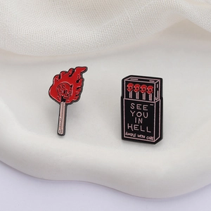 Dark style matchbox and skull match enamel pin set with See You In Hell slogan