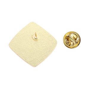 Detail view of the gold metal brooch back and butterfly clutch pin backing fastener