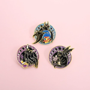 Three-piece set of gothic enamel bat and owl pins with golden metal edges