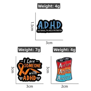 Detail view of ADHD awareness enamel pins showing dimensions and mental health themes