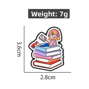 Detail view of cartoon enamel book brooch with size measurements and 7g weight data