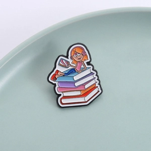 Cartoon girl with pink headphones lying on colorful books enamel pin badge