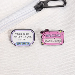Enamel bookish brooch set featuring Bookish Girlie and 5 Stars quote on canvas bag