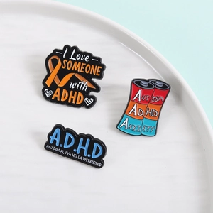 Three-piece set of ADHD and Autism awareness enamel pins with colorful metal designs