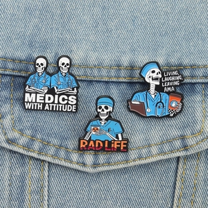 Three skeleton medic enamel pins with creative medical slogans on denim jacket pocket