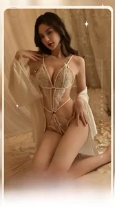 Detailed close-up of cream lace teddy lingerie with bow decor and open crotch design