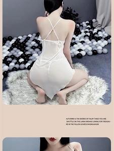 Detailed back view of white sheer mesh chemise with delicate cross strap design