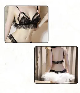 Detail of black lace lingerie set with open cups, pink satin bows and pearl charms