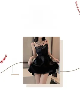 Detailed view of black satin lingerie with lace trim and delicate multi-strap shoulders