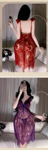 Detail view of sheer lace lingerie nightdress with delicate ruffles and thin straps