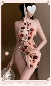 Detail of floral pink cheongsam featuring hollow-out design and high side slit