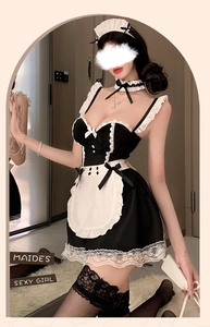 Detail of maid cosplay set featuring black lace lingerie and white ruffled apron