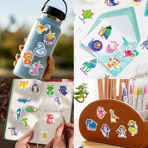 Detailed view of waterproof cartoon animal stickers applied on bottles and stationery items