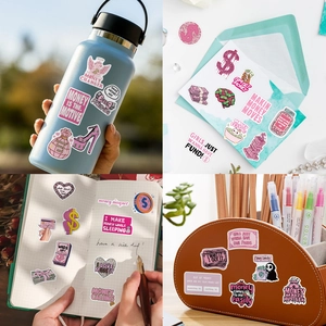 Close-up of pink money-themed stickers on a water bottle and notebook for decoration